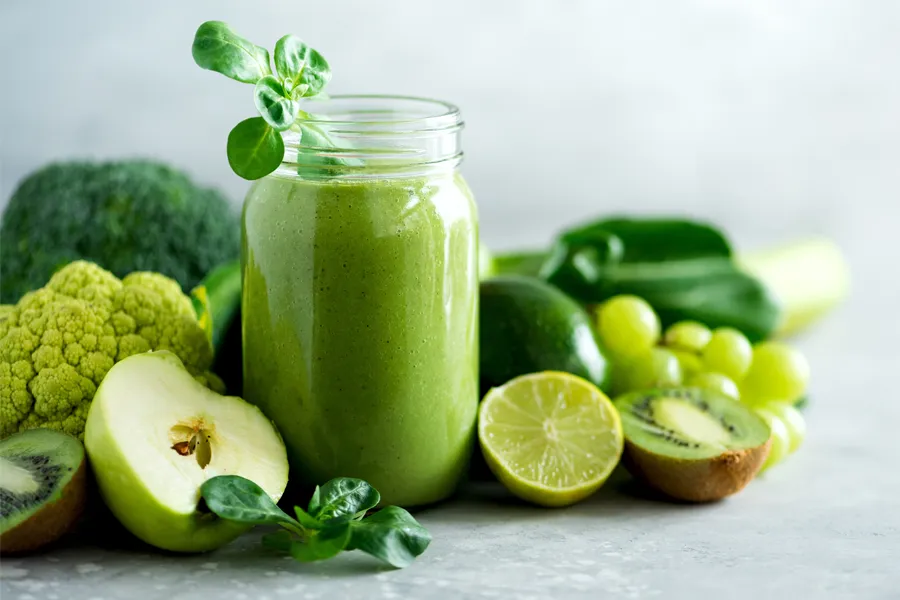 Nutritional-Counseling-Clinic A tableau of healthy green fruits and vegetables and juices. Get nutritional counseling from Dr. Robert Powers of Eternal Vitality Orlando in Orlando.